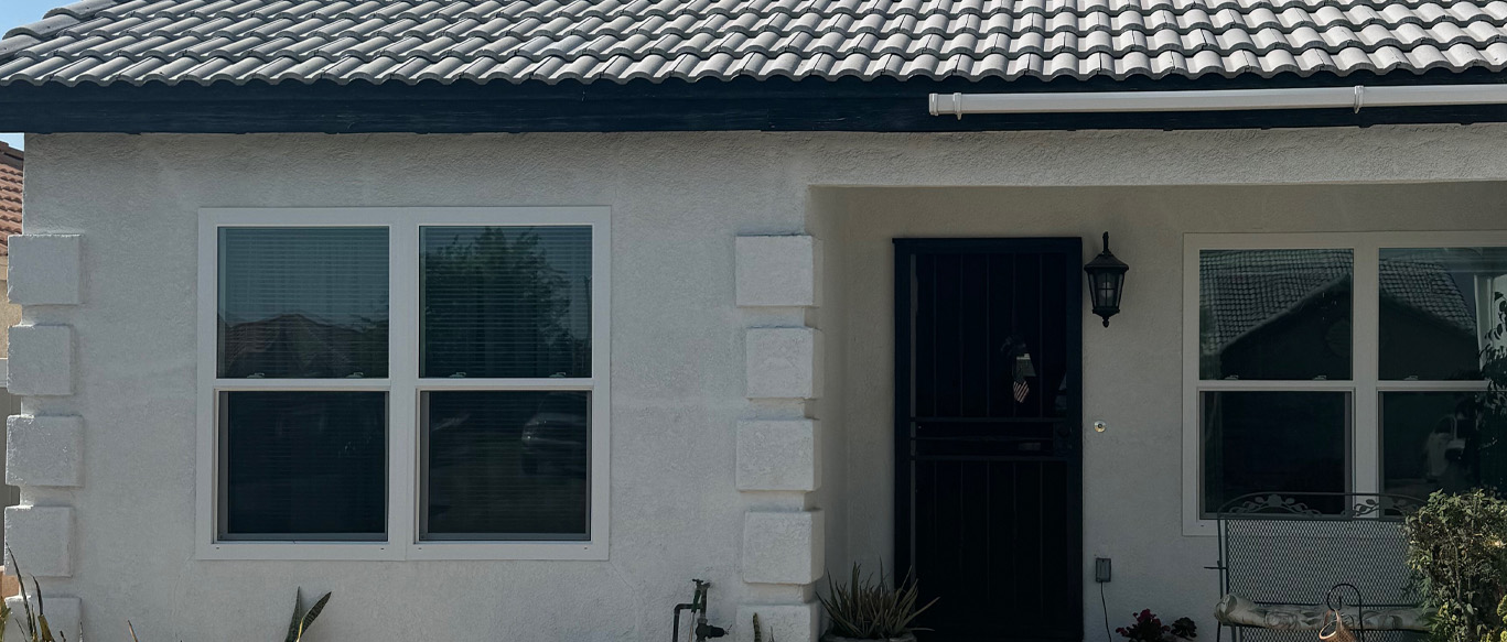 Residential home in Anaheim, CA with dual-pane windows and tile roof, highlighting the benefits of energy-efficient window replacement before summer heat.
