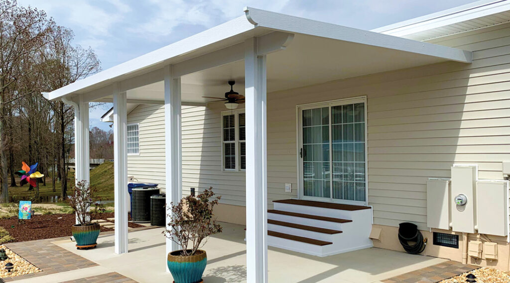 Newly installed patio cover providing shade over backyard in Rancho Cucamonga CA