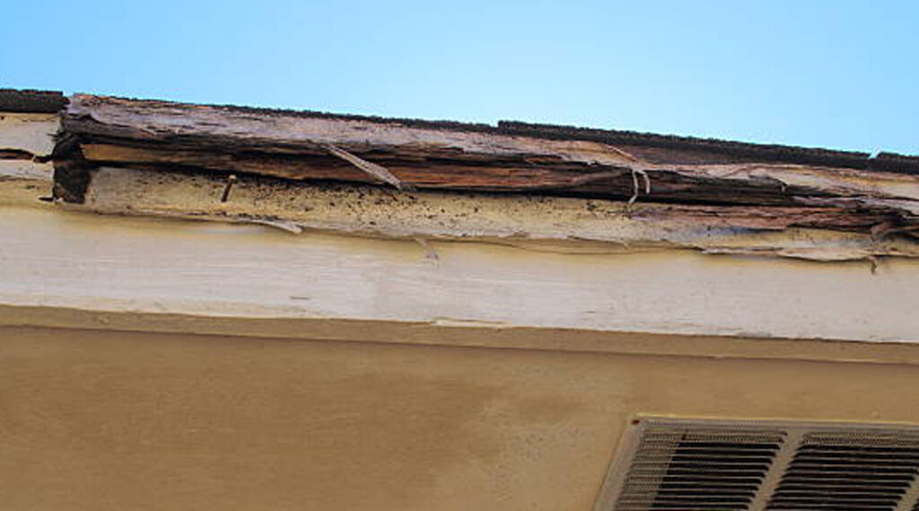 Roof edge wood rot and damaged eaves on residential home in Lake Elsinore CA