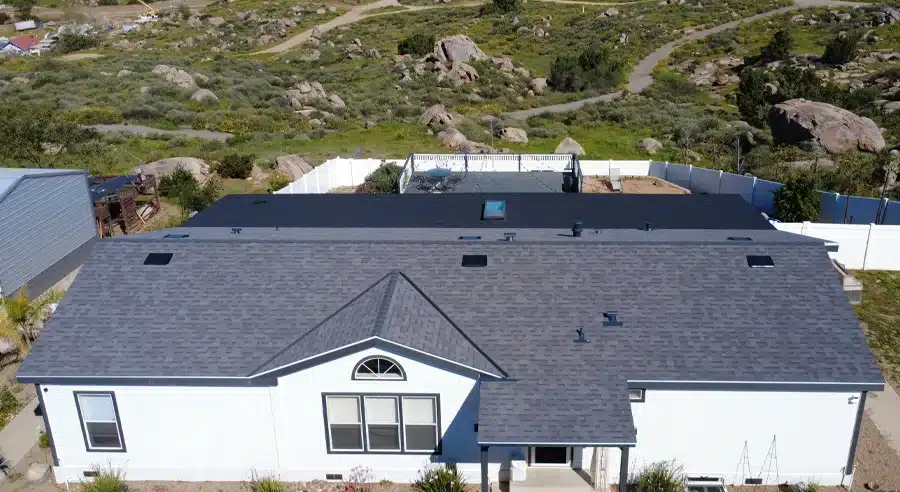 Aerial view of a completed asphalt shingle roof replacement on a Southern California home by Innovative Home Improvements.